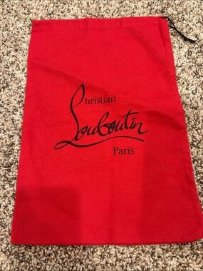 Christian Louboutin red drawstring dust bag 10” x 15”.